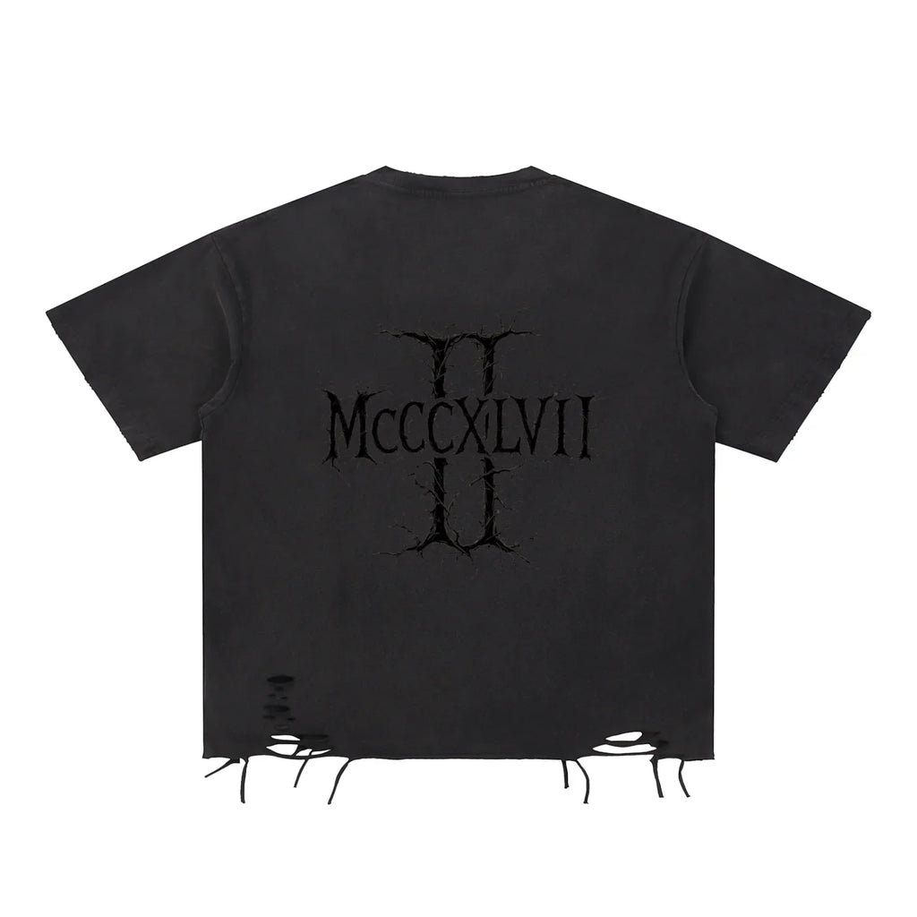 Black distressed streetwear tee with cracked Roman numerals graphic and ripped hem detail