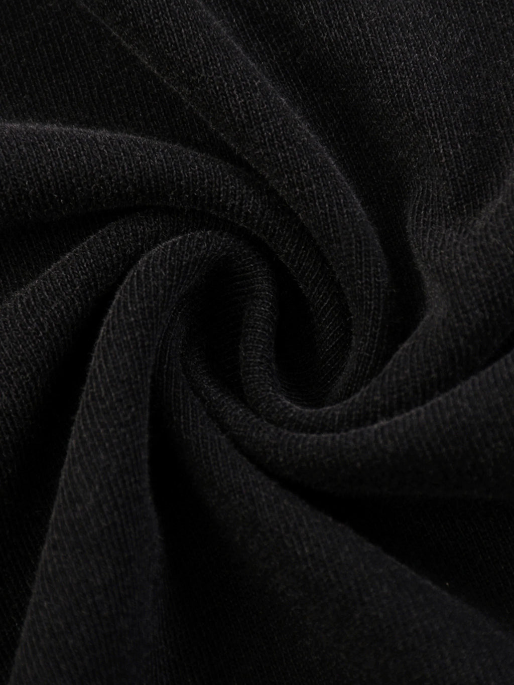 close-up of soft black cotton fabric with textured knit detail, ideal for urban streetwear
